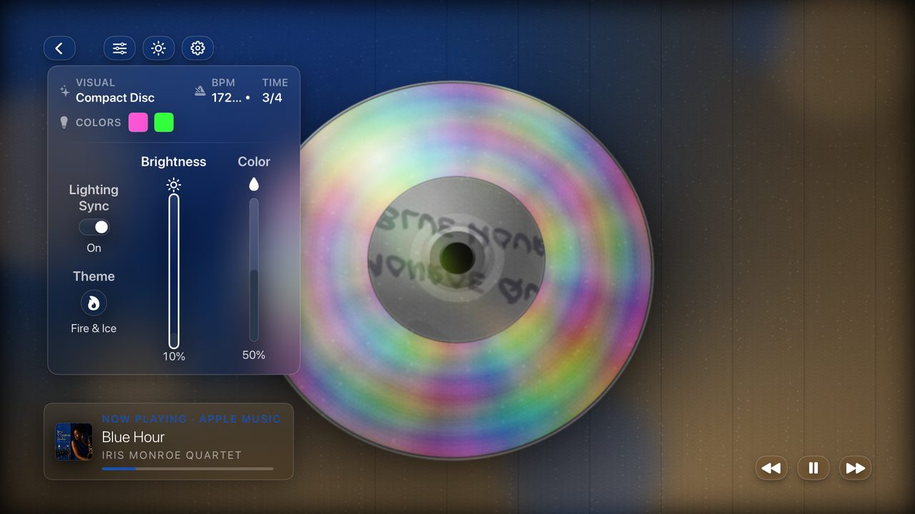 A full-screen visual playing over a track, with the adjust panel showing tempo, colours and light sync