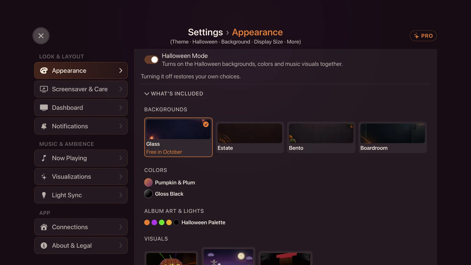 Settings, Appearance, with the Halloween Mode switch on and What's Included open, showing four theme backgrounds with Glass marked Free in October, the Pumpkin & Plum and Gloss Black colors, the Halloween palette and the three visuals.