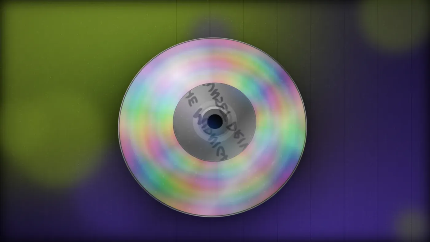 Compact Disc. Pro. A spinning disc catching the light.